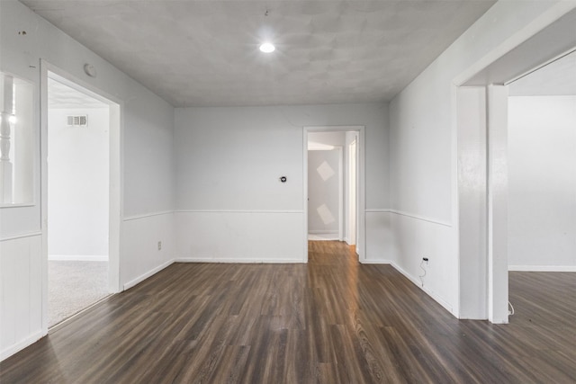 4331 Kolloch Dr, Dallas, TX 75216 - spare room with baseboards, visible vents, and dark wood finished floors