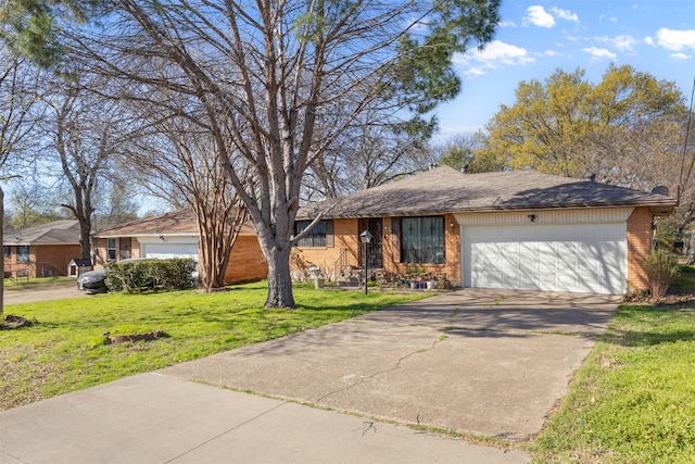 4331 Kolloch Dr, Dallas, TX 75216 - single story home featuring brick siding, a garage, concrete driveway, and a front yard