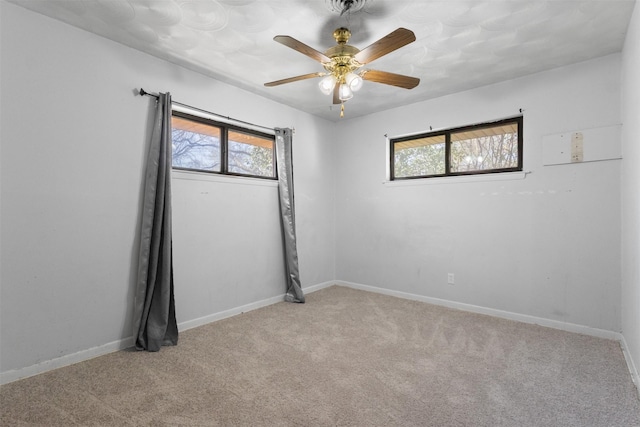 4331 Kolloch Dr, Dallas, TX 75216 - empty room featuring baseboards, a wealth of natural light, a ceiling fan, and light colored carpet