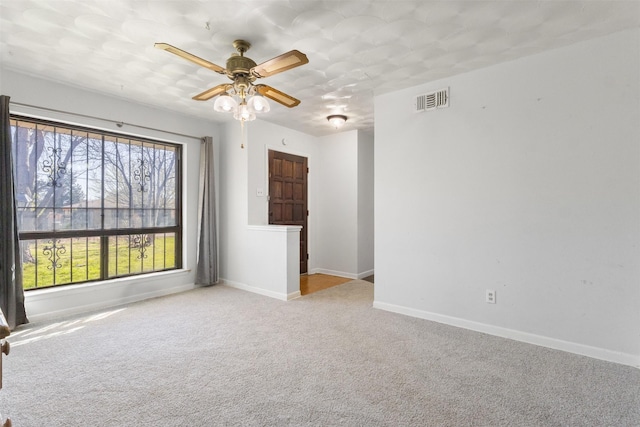 4331 Kolloch Dr, Dallas, TX 75216 - carpeted empty room with baseboards, visible vents, and a ceiling fan