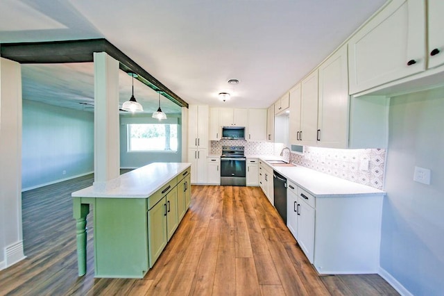3815 Jefferson Rd, Paris, TX 75462 - kitchen with electric stove, light wood finished floors, white cabinets, and backsplash