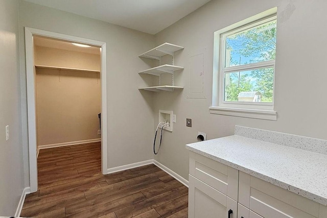 3815 Jefferson Rd, Paris, TX 75462 - clothes washing area featuring hookup for an electric dryer, dark wood finished floors, hookup for a washing machine, baseboards, and cabinet space