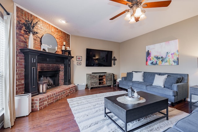 796 Ridge Rd W, Rockwall, TX 75087 - living area featuring a ceiling fan, wood finished floors, and a brick fireplace