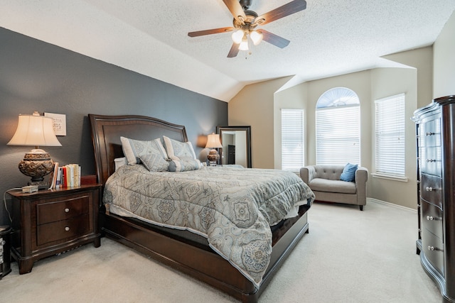 796 Ridge Rd W, Rockwall, TX 75087 - bedroom with light carpet, vaulted ceiling, a textured ceiling, and ceiling fan