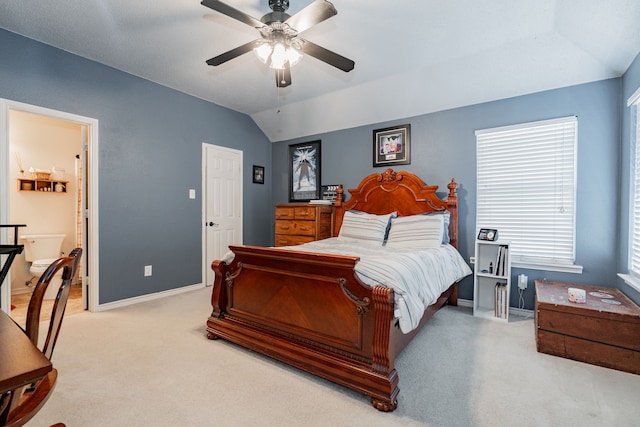 796 Ridge Rd W, Rockwall, TX 75087 - carpeted bedroom with lofted ceiling, baseboards, a ceiling fan, and ensuite bathroom