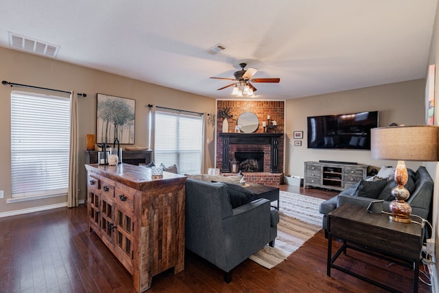 796 Ridge Rd W, Rockwall, TX 75087 - living room featuring ceiling fan, dark wood-style flooring, baseboards, and a fireplace