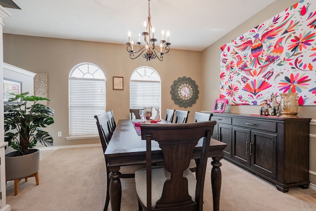 796 Ridge Rd W, Rockwall, TX 75087 - dining area with a chandelier, light carpet, and baseboards
