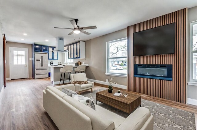2618 San Marcus Ave, Dallas, TX 75228 - living area featuring baseboards, ceiling fan, recessed lighting, and light wood-type flooring