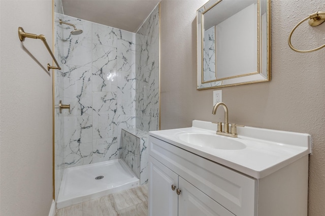 2618 San Marcus Ave, Dallas, TX 75228 - bathroom with a stall shower, vanity, and a textured wall