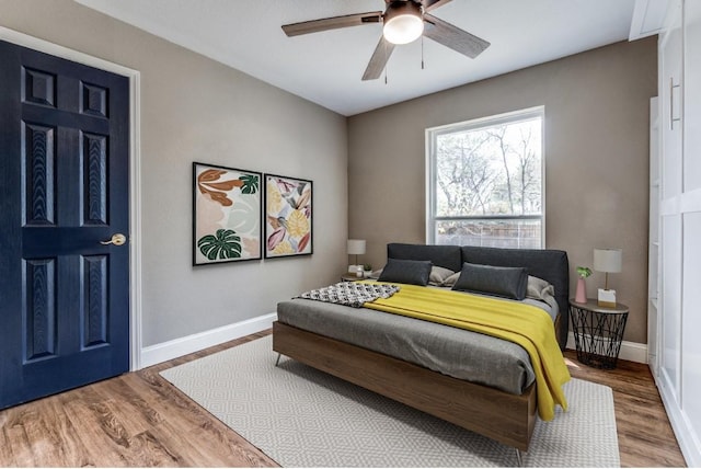 2618 San Marcus Ave, Dallas, TX 75228 - bedroom with wood finished floors, baseboards, and ceiling fan