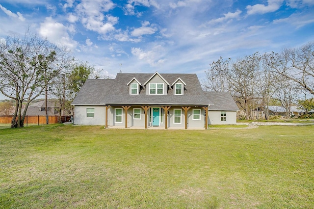 cape cod-style house featuring fence, a porch, and a front lawn