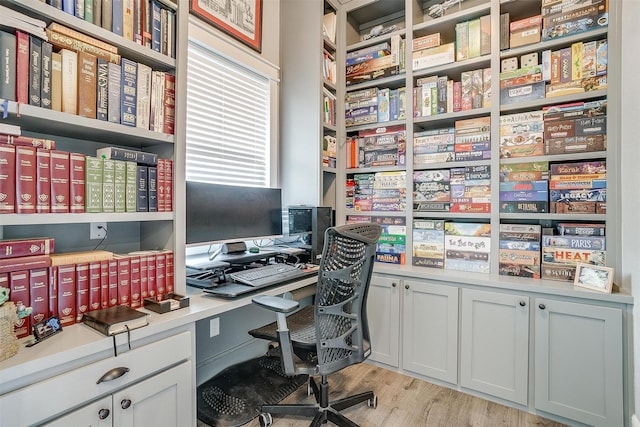 home office with light wood-style flooring