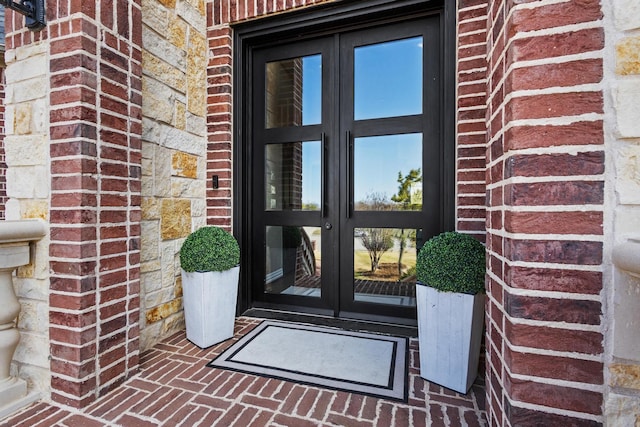 181 Monarch Dr, Denison, TX 75020 - doorway to property with brick siding and french doors