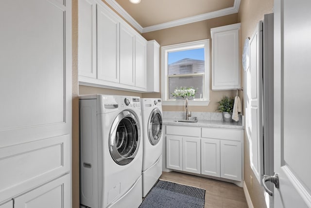 181 Monarch Dr, Denison, TX 75020 - washroom with cabinet space, ornamental molding, a sink, and washer and clothes dryer