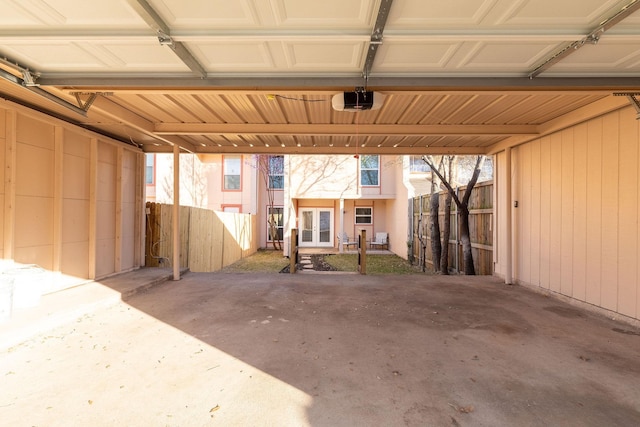 garage with french doors and a garage door opener