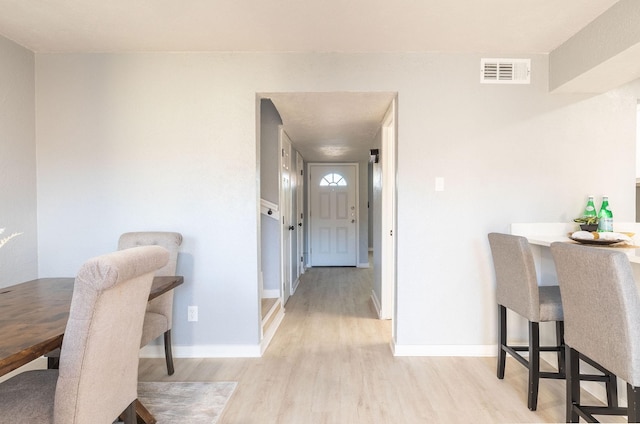 dining area with wood finished floors and baseboards