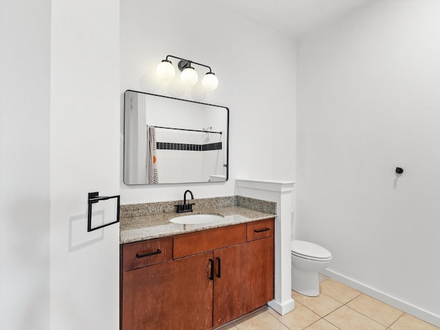 bathroom with tile patterned flooring, vanity, toilet, baseboards, and curtained shower