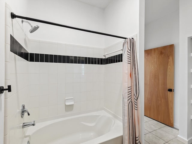 bathroom featuring shower / bath combination with curtain and tile patterned flooring