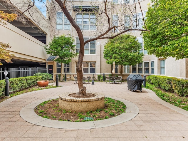 view of property's community with a patio area