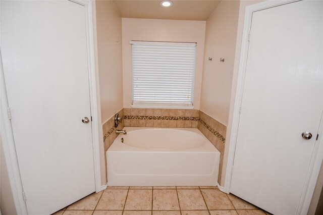 full bathroom with a bath, recessed lighting, and tile patterned floors