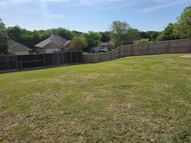 view of yard featuring a fenced backyard