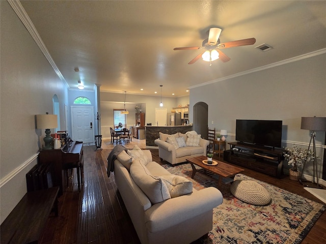 714 Green Acres Ln, Midlothian, TX 76065 - living room featuring arched walkways, hardwood / wood-style flooring, a ceiling fan, crown molding, and baseboards