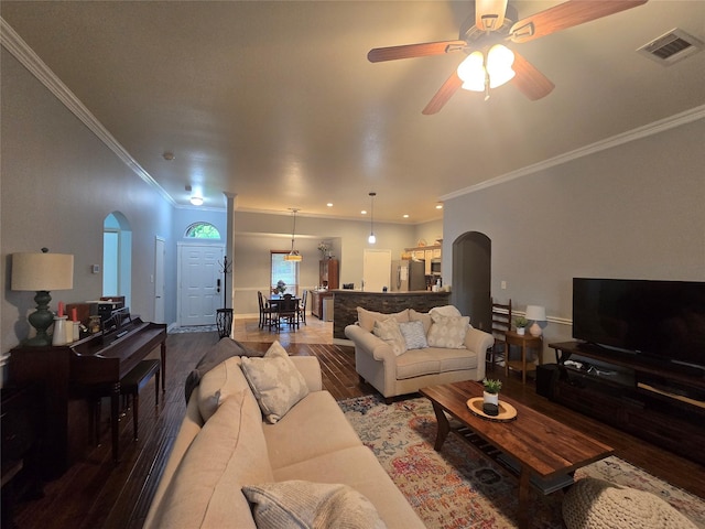 714 Green Acres Ln, Midlothian, TX 76065 - living room featuring arched walkways, wood finished floors, crown molding, a ceiling fan, and baseboards