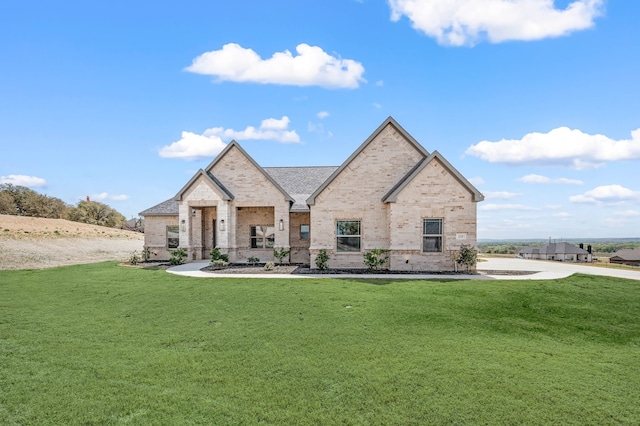 225 Oak Meadow Ln, Weatherford, TX 76085 - french country inspired facade featuring a front lawn and brick siding