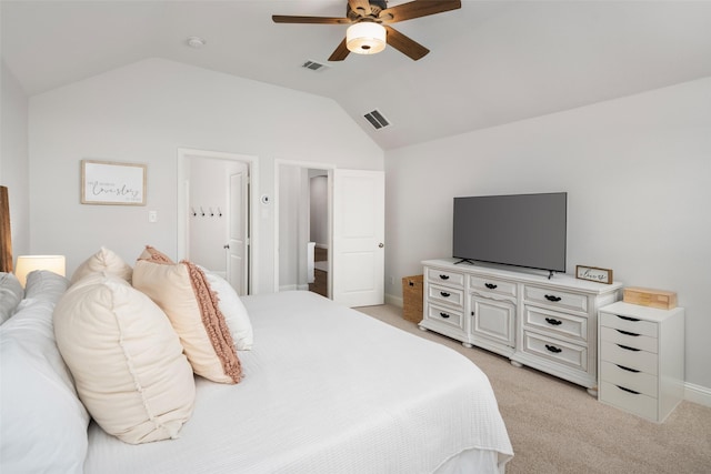 bedroom featuring light carpet, vaulted ceiling, and visible vents