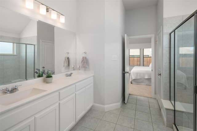 bathroom with a sink, a stall shower, and plenty of natural light