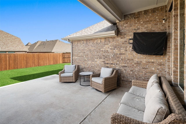 view of patio featuring outdoor lounge area and fence