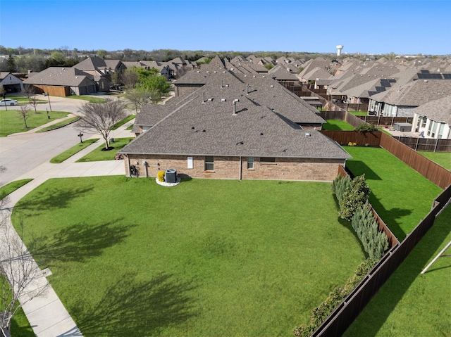 birds eye view of property with a residential view