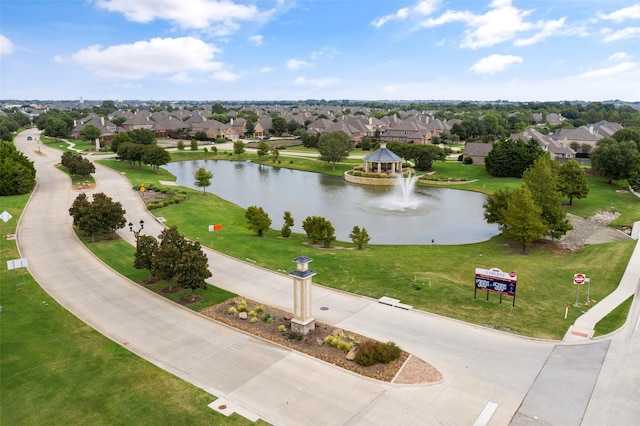 birds eye view of property with a water view and a residential view