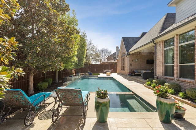 3960 Briar Tree Ln, Frisco, TX 75034 - view of swimming pool featuring a fenced backyard, a patio area, an outdoor hangout area, and a pool with connected hot tub