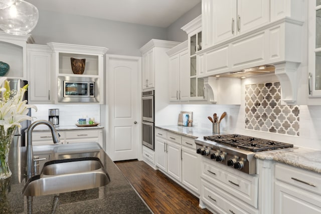 3960 Briar Tree Ln, Frisco, TX 75034 - kitchen with appliances with stainless steel finishes, open shelves, a sink, decorative backsplash, and white cabinetry