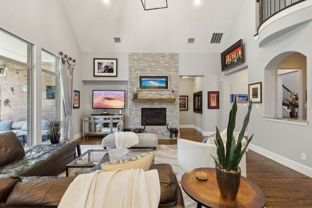 3960 Briar Tree Ln, Frisco, TX 75034 - living room featuring high vaulted ceiling, wood finished floors, a fireplace, and baseboards