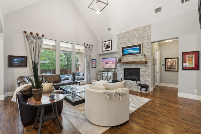 3960 Briar Tree Ln, Frisco, TX 75034 - living room featuring high vaulted ceiling, baseboards, a fireplace, and wood finished floors