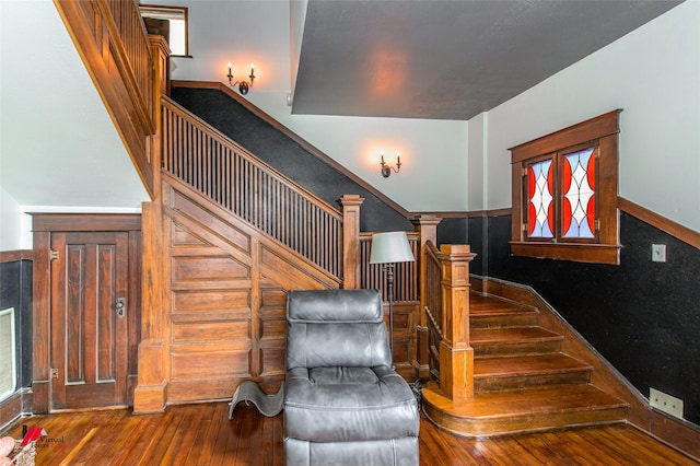 staircase featuring wood-type flooring