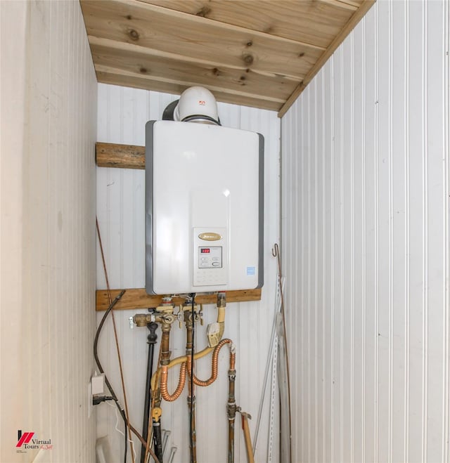 utility room with tankless water heater