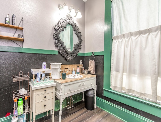 bathroom featuring a sink and wood finished floors