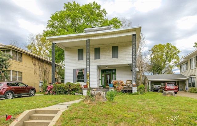 view of front of home featuring covered porch, a front lawn, and a carport