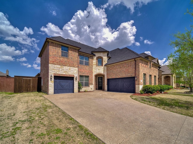 2007 Bent Creek Way, Mansfield, TX 76063 - view of front of home with roof with shingles, a front yard, fence, concrete driveway, and stone siding