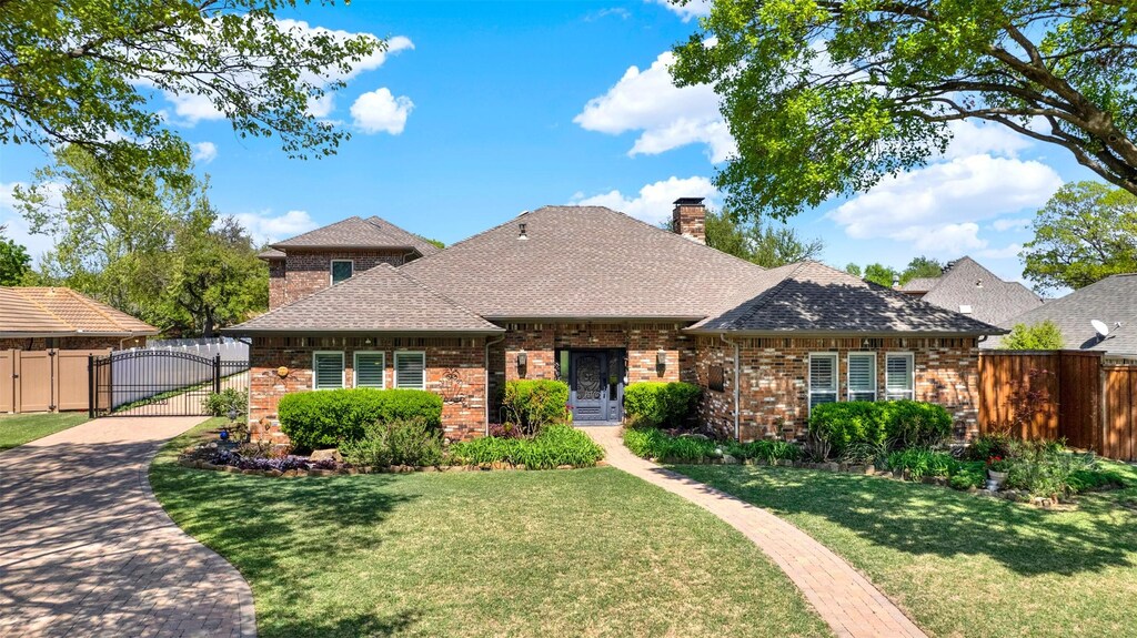 3315 Gatwick Pl, Farmers Branch, TX 75234 - view of front of property with a chimney, a gate, a front yard, brick siding, and fence