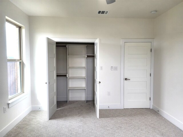 144 Shawnee Trl, Pottsboro, TX 75076 - unfurnished bedroom featuring baseboards, visible vents, a closet, and carpet flooring