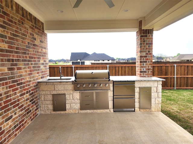144 Shawnee Trl, Pottsboro, TX 75076 - view of patio / terrace featuring a ceiling fan, a sink, grilling area, fence, and area for grilling