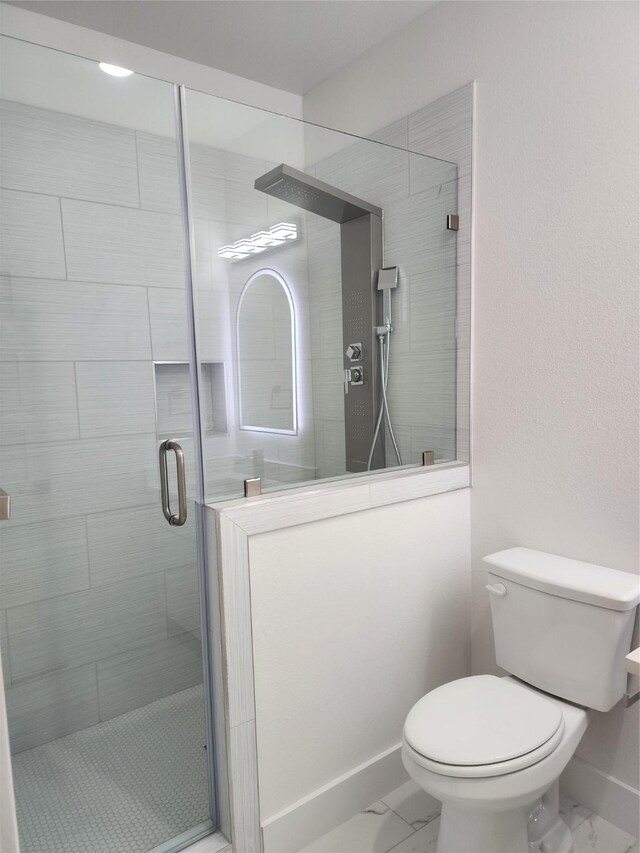 144 Shawnee Trl, Pottsboro, TX 75076 - bathroom featuring baseboards, marble finish floor, a stall shower, and toilet