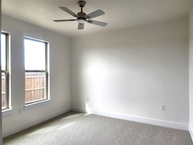 144 Shawnee Trl, Pottsboro, TX 75076 - carpeted empty room with baseboards, a ceiling fan, and plenty of natural light