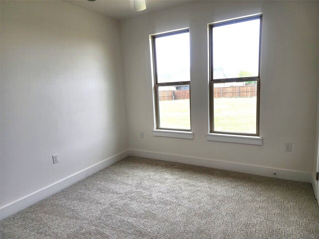 144 Shawnee Trl, Pottsboro, TX 75076 - empty room featuring baseboards, a ceiling fan, and carpet