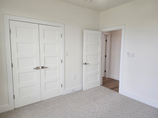 144 Shawnee Trl, Pottsboro, TX 75076 - unfurnished bedroom with carpet floors, a closet, and baseboards