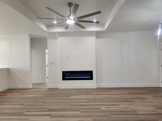 144 Shawnee Trl, Pottsboro, TX 75076 - unfurnished living room with light wood finished floors, a glass covered fireplace, baseboards, recessed lighting, and a ceiling fan